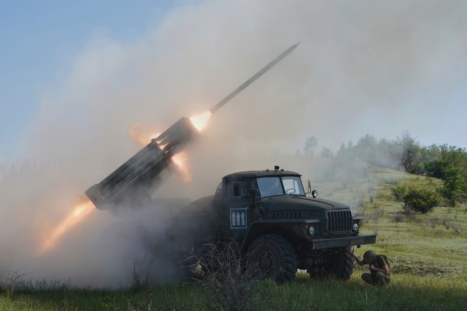 A Grad multiple rocket launcher firing rockets.